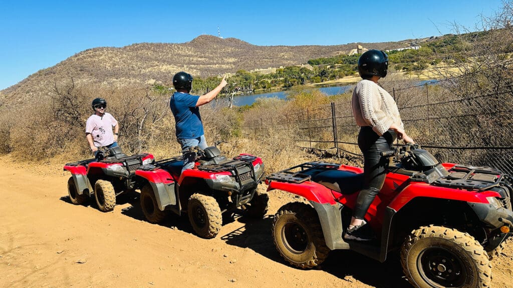 Family viewing Sun City on Horizon from Quad Bike