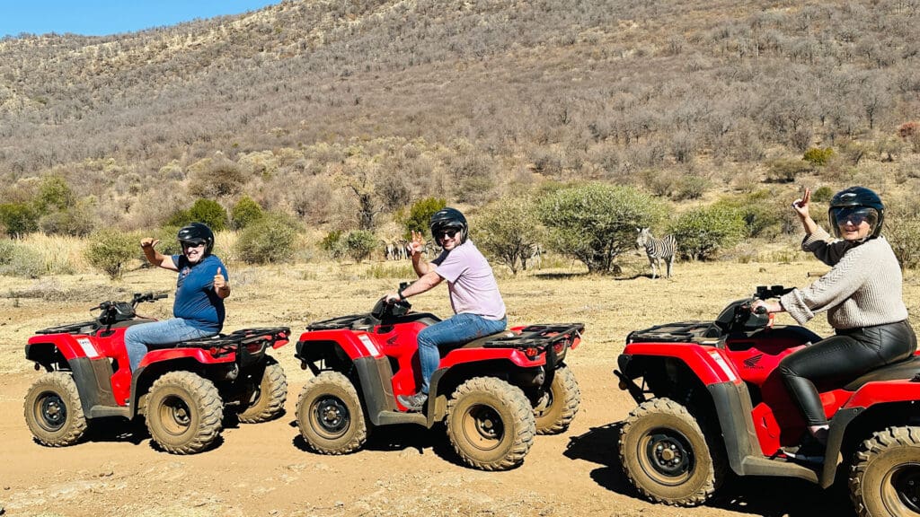 Family viewing zebras from Quad Bike